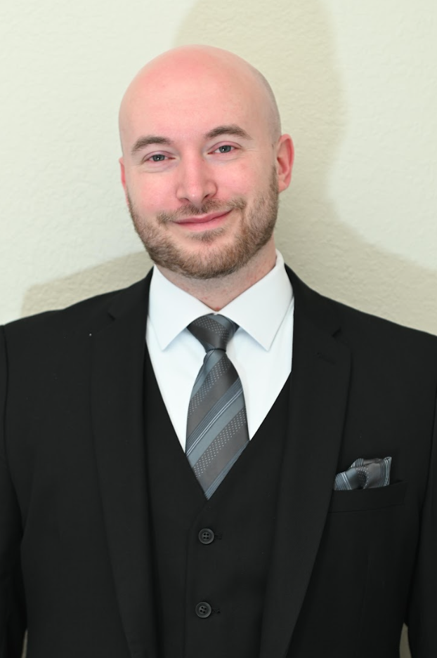 Dr. Kevin Muceus, A Licensed Therapist Specializing In Telehealth Therapy Services For Adults And Adolescents With Mental Health Concerns.